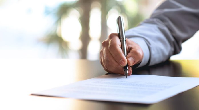 Top 5 Essay Writing Services in the UK Signing Official Document