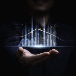 A Step-By-Step Guide on How to Learn Algorithmic Trading Businessman or trader showing glowing virtual technical investment graph chart for analysis stock market , Banking financial and planing concept.