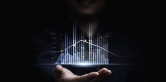 Businessman or trader showing glowing virtual technical investment graph chart for analysis stock market , Banking financial and planing concept.