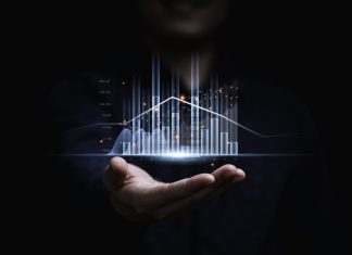 A Step-By-Step Guide on How to Learn Algorithmic Trading Businessman or trader showing glowing virtual technical investment graph chart for analysis stock market , Banking financial and planing concept.