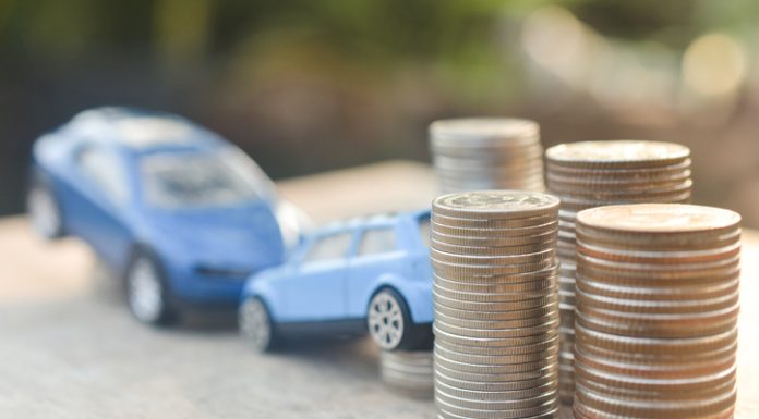 Are You Invalidating Your Car Insurance By Doing These Things? Coins stack and car model on wood table