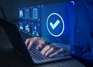 How Computers Became an Integral Part of Your Life Quality management with QA (assurance), QC (control) and improvement. Standardisation and certification concept. Compliance to regulations and standards. Manager or auditor working on computer.
