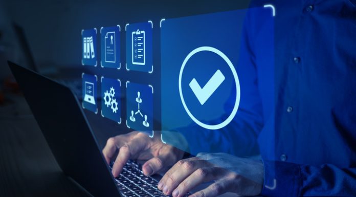 How Computers Became an Integral Part of Your Life Quality management with QA (assurance), QC (control) and improvement. Standardisation and certification concept. Compliance to regulations and standards. Manager or auditor working on computer.