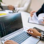 The Popularity of Crypto Funds Sparks Growing Interest from Managers girl working on laptop