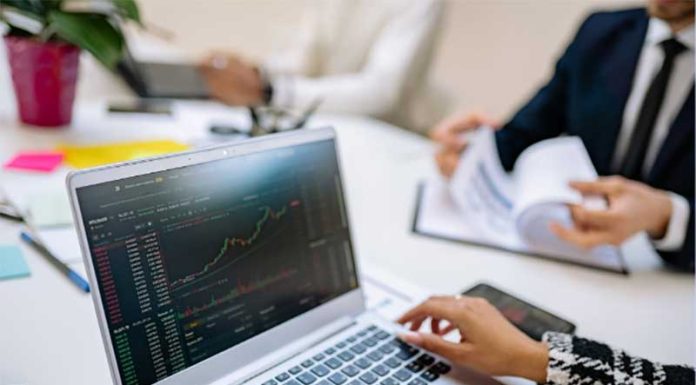 The Popularity of Crypto Funds Sparks Growing Interest from Managers girl working on laptop