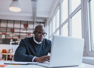 How to Write a Research Paper Businessman working on laptop in office