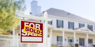Sold Home For Sale Sign in Front of New House