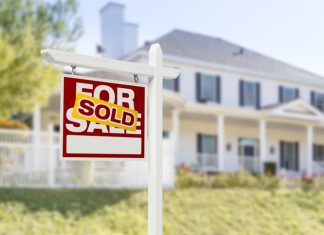 Sold Home For Sale Sign in Front of New House