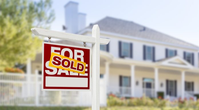 How to Sell Your House or Apartment Quickly? Sold Home For Sale Sign in Front of New House