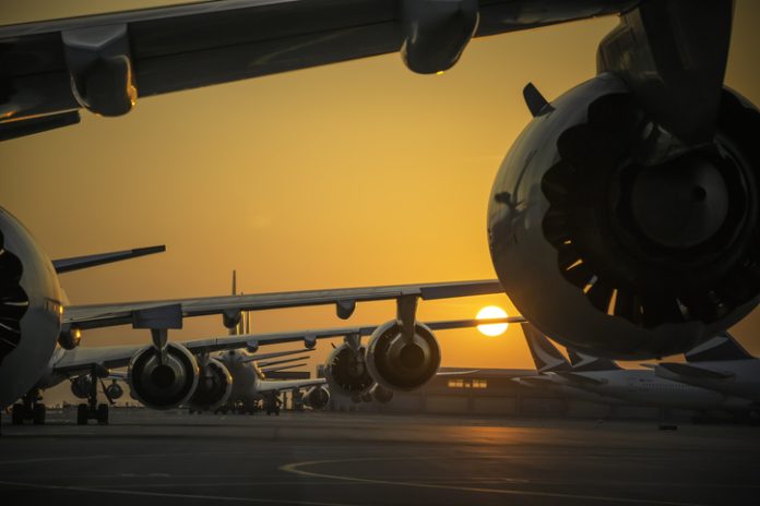 sunset view of airplanes line up fractional aircraft ownership