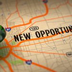 New Opportunities - Green Pushpin on a Map Background.