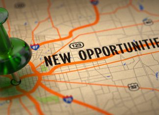 New Opportunities - Green Pushpin on a Map Background.