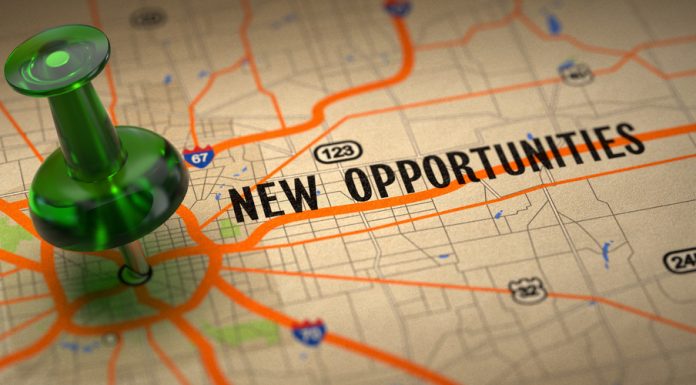 What To Consider When Selecting A Second Business Location New Opportunities - Green Pushpin on a Map Background.
