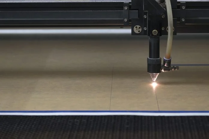cutting machine carving patterns on the plastic plate CNC machining