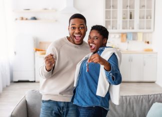 How Landlords Can Make Their Tenants Happier in 2023 Happy African American couple showing keys of their new apartment
