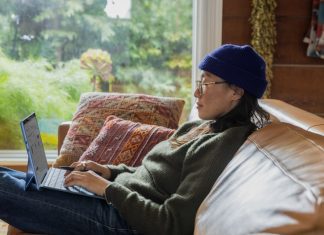 A woman working on business decisions on her laptop