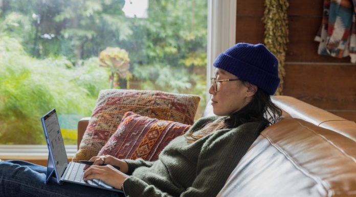 Utilizing Microservice Reporting, Streamlining Communication, and More Tips for Business Leaders A woman working on business decisions on her laptop