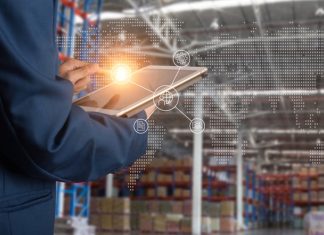 The Evolution of Modern Logistics: How Dynamics 365 Supply Chain Management is Paving the Way Logistic and transport concept Businessman manager using tablet check and control and planning for Modern Trade warehouse logistics.