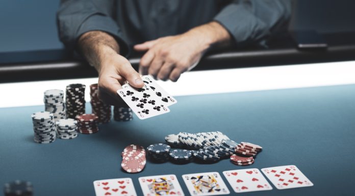 Man playing Texas Hold 'em poker at Casino