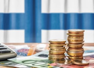 Legal Ways to Earn Money Online in Finland Euro banknotes and coins in front of the national flag of Finland