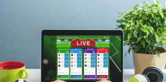 Big Data in Online Gambling: Using Analytics for Competitive Advantage Man using laptop for betting online at bookmaker's website. Sport, gambling, money win concept.