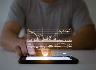 Are you on the Lookout for a Promising Stock Investment Opportunity That Combines Innovation, Technology? A man use checking a business graph with a hand touch screen smartphone technology"n