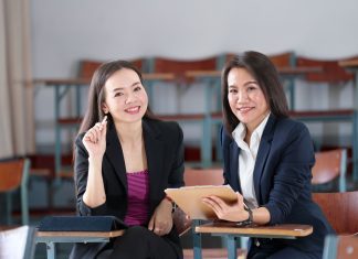 Master's degree female student sitting in the classroom at university