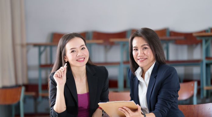 The Academic Crossroads: Who Needs an MBA or Executive Education? Master's degree female student sitting in the classroom at university