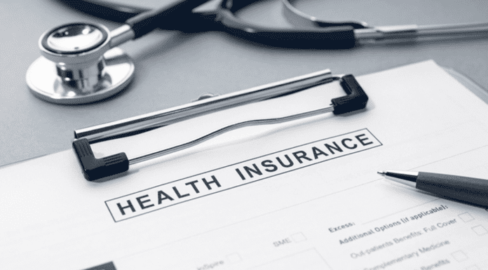 Top 10 Benefits of International Health Insurance Health Insurance form and stethoscope on desk