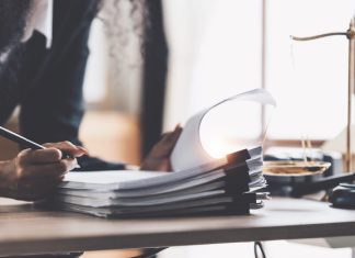 Lawyer business woman working or reading lawbook in office workplace for consultant lawyer concept