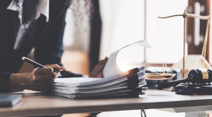 The Benefits of Hiring a Tax Consultant for Small Businesses Lawyer business woman working or reading lawbook in office workplace for consultant lawyer concept