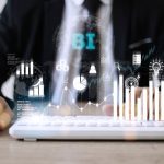 Business, Technology, Internet and network concept. people working on the future, select on the virtual display: Business intelligence