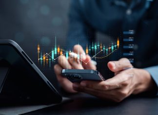 The Beginner’s Guide to Options Trading Strategies Businessmen investor think before buying stock market investment using smartphone to analyze trading data. investor analysis with stock exchange graph on screen. Financial stock market.
