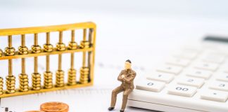 Retirement Income Redefined: Annuities as Predictable Cash Flow K-line chart, abacus, calculator, and coins