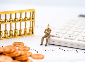 Retirement Income Redefined: Annuities as Predictable Cash Flow K-line chart, abacus, calculator, and coins