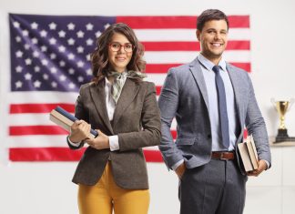 Exploring The Importance of Business and Political Internships in Shaping College Experiences with Dennis Bonnen Young man and woman holding books in front of USA flag