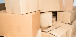 Moving for your Business Growth: Choose the Right Office Mover Detail of many cardboard boxes full of household items during a move.