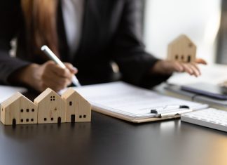 How to Maximize Returns in UK Property Investment Real estate contract signing concept. Businesswoman signing a contract to legally for the purchase, mortgage and rental of real estate.