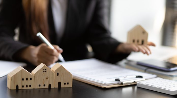 Real estate contract signing concept. Businesswoman signing a contract to legally for the purchase, mortgage and rental of real estate.