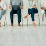 Recruitment, job and hiring interview with people waiting for hire team using technology. Potential business office digital tech workers ready for contact us agency meeting on a computer and phone