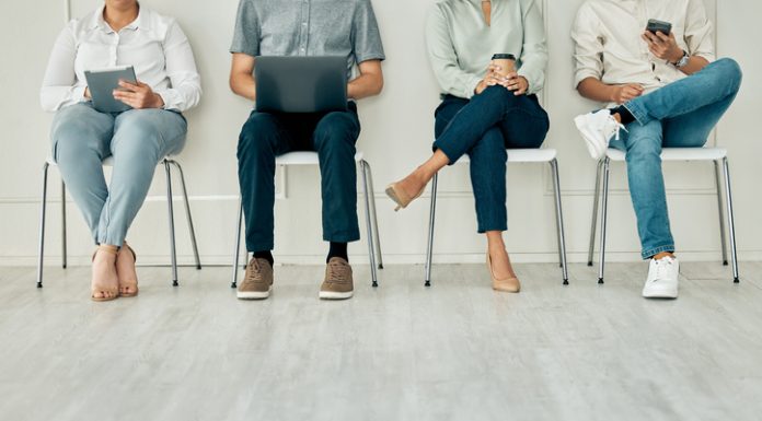 Recruitment, job and hiring interview with people waiting for hire team using technology. Potential business office digital tech workers ready for contact us agency meeting on a computer and phone