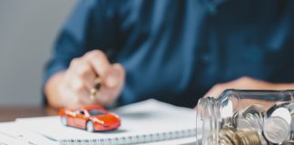 Car Title Loans Zebra Finance: Navigating Secure Financing Solutions Concept of car insurance business, saving buy - sale with tax and loan for new car. Car toy vehicle with stack coin money on background. Planning to manage transportation finance costs. loan for car