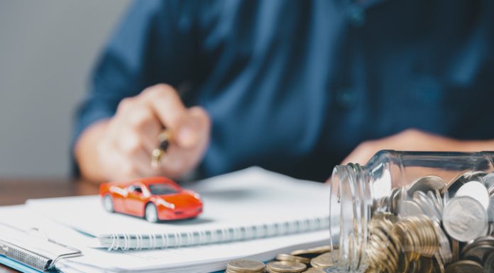 Concept of car insurance business, saving buy - sale with tax and loan for new car. Car toy vehicle with stack coin money on background. Planning to manage transportation finance costs. loan for car