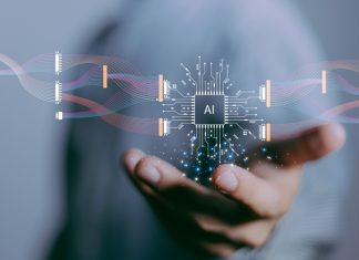 Guess What… AI Will Be a Big Talking Point in 2024 focus hand of businessman show virtual graphic data connect with AI.Using AI to sucess everything, Futuristic data technology.