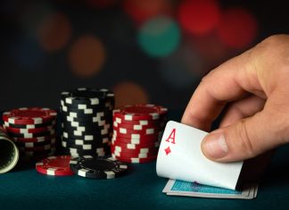 The player takes out an ace of diamonds from a deck of cards in a game of poker. Winning depends on luck