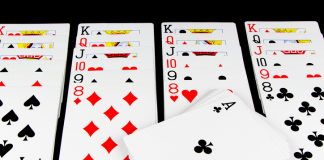 The Competitive Edge: Strategies for Winning at Online Solitaire Playing Cards Game on Black Background
