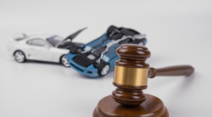 hammer of the judge. two collided cars on a white background.