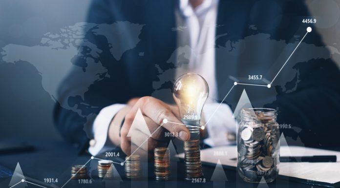 Navigating Through Trader Funding Options: FundedNext And Other Top Competitors Businessman holding illuminated light bulb