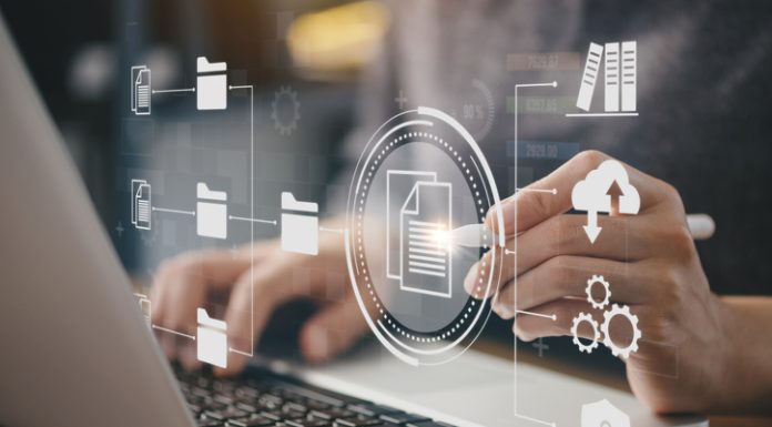 Businessman using a computer to document management concept, online documentation database and digital file storage system or software, records keeping, database technology, file access, doc sharing.