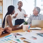 Seeking Alpha Review – In 2024 Is Seeking Alpha Still Valuable? Black woman sharing ideas to employees